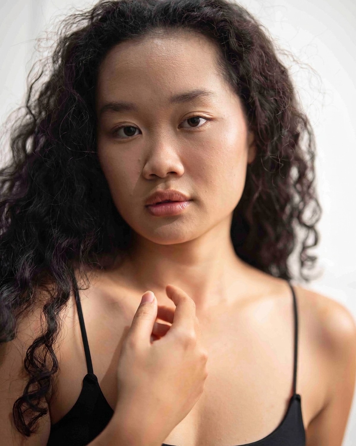 Amelia Ali expressive studio portrait with curls loose